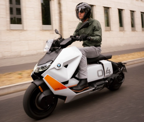 person riding bmw scooter